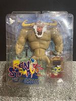 Front image of the 2004 Ren and Stimpy Shaven Yak action figure in sealed packaging showing the figure and accessories clearly. Notes dents in plastic but package still sealed.
