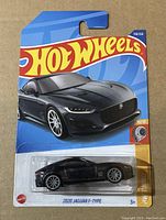 Front view of sealed Hot Wheels 2020 Jaguar F-Type on blue card showing artwork and product details.