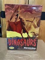 Front of the sealed Aurora Dinosaurs Pteranodon model kit box showing artwork and branding.