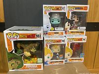 Full view of all five boxed Funko POP figures from Dragon Ball Z including Porunga, Whis, Goku, Super Saiyan 2 Vegeta, and Super Saiyan Vegeta.