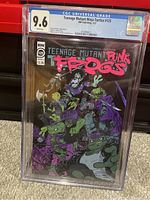 Front view of Teenage Mutant Ninja Turtles #125 Punk Frogs comic graded 9.6 by CGC in a protective case.