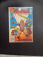 Front cover of the comic book showing He-Man with sword and axe surrounded by other characters, vibrant colors, clear title 'Masters of the Universe' with 75¢ price and DC Comics logo.
