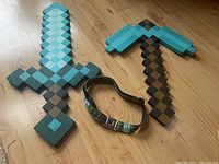 Minecraft foam sword and pickaxe toys alongside an adjustable Minecraft-themed kids belt.