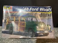 Front view of the sealed Revell Monogram '48 Ford Woody model kit box showing the model car image and product branding.
