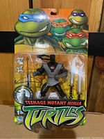 Front view of the sealed Teenage Mutant Ninja Turtles Foot Soldier figure in blister packaging showing the character and accessories inside.