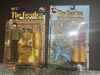 Both Beatles Yellow Submarine figures on original blister cards, sealed and new in package.