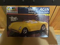 Front of sealed box showing the yellow Vette AGIN model car, skill level 2, 1:24 scale.