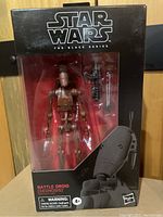 Photo shows sealed Star Wars Black Series Battle Droid figure in original box with black and red packaging and visible accessories.