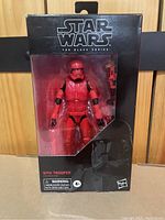 Sealed Star Wars Black Series Sith Trooper action figure in original packaging showing front view with figure visible through clear window.