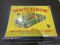 Top view of the folded case front flap with green car illustration and text.