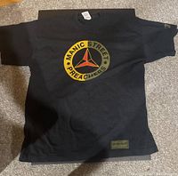 Full view of the black vintage Manic Street Preachers T-shirt laid flat showing front print and shape.