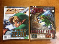 Both magazines side by side showing front covers, featuring Link from The Legend of Zelda: Ocarina of Time with colorful art and titles.