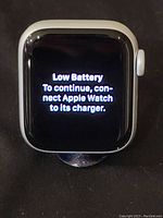 Front view showing low battery message on display