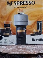 Original packaging showing Nespresso Vertuo Next machine by Breville