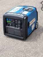 Front and top view of blue Hyundai generator showing control panel, outlets, and fuel cap