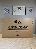 Original cardboard box with LG Digital Signage branding and 86″ label