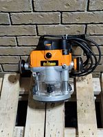 Front view of Triton dual-mode router showing body, base and cord