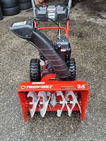 Front view showing 24-inch auger housing with Troy-Bilt logo