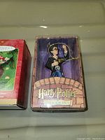 Front view of the Harry Potter ornament in original box showing detailed figurine and packaging.