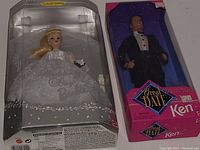 Photo of unopened Wedding Day Barbie reproduction doll in white wedding dress next to unopened Great Date Ken original in tuxedo