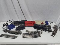 Overview of the full train set including engines, caboose, tracks, and transformer control.