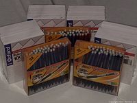 Three boxes of BIC mechanical pencils (32 pencils each) in front of four boxes of white ruled index cards from Oxford (1000 cards each). All items are new and unopened, neatly arranged.