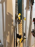Close-up view of skis and poles showing bindings and branding