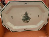 Top-down view of the full octagonal platter showing Christmas tree design and green border.