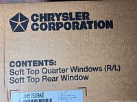 Close-up photo of Chrysler Corporation box listing contents as Soft Top Quarter Windows (R/L) and Soft Top Rear Window.