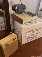 Main clock radio and separate external speaker on top of original Melody-Alarm box