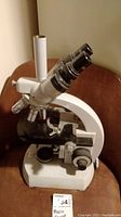 Front three-quarter view of microscope on surface