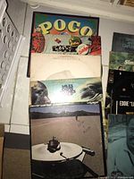 Photo showing vinyl albums including Poco, Dexter Wansel, Miles Davis
