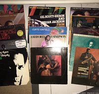 Photo showing a group of 15 vinyl album covers including artists Grover Washington Jr., Gil Scott-Heron and Brian Jackson, Ashford & Simpson, Curtis Mayfield, The Brothers Johnson, Marvin Gaye, Roy Ayers, Kool & The Gang, Foxy, Joe Sample and Cannonball Adderley.