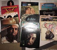 Photo showing front covers of 15 assorted vinyl record albums by various funk, jazz, and soul artists.