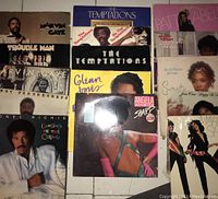 Overhead photo showing 15 vinyl record albums from various soul and R&B artists including Marvin Gaye, The Temptations, Glenn Jones, Angela Winbush, Lionel Richie and Patti LaBelle.