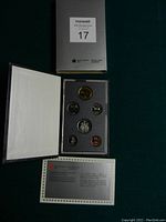 View of the 6 Canadian coins in the original mint packaged display folder with informational card and outer sleeve.
