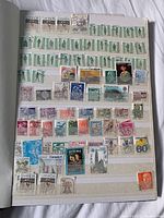 Sheet with Canadian, Bermuda, and other assorted stamps showing various designs and denominations.