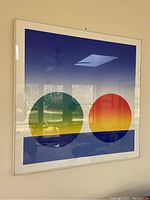 Frontal view of framed screenprint showing composition of two gradient spheres.