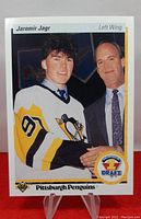 Front of the 1990-91 Upper Deck Jaromir Jagr rookie card, showing Jagr in Penguins uniform shaking hands with a man, with draft badge and team info.