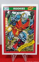 Front image of 1990 Impel Marvel Series 1 Deathlok trading card with artwork of Deathlok character in red and metallic armor, labeled as rookie card from 1990.