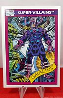 Photo of the 1990 Impel Marvel Series 1 Galactus trading card on display stand showing the front artwork and text.