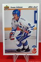 Front view of 1991-92 Upper Deck Teemu Selanne rookie hockey card showing player in Finland jersey skating on ice.