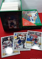Box of hockey cards with some cards laid out showing several player cards from 1996-97 Topps Picks series.