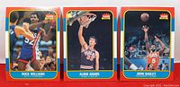 Front views of the three 1996 Fleer basketball cards of Buck Williams, Alvan Adams, and John Bagley showing player images and Fleer logo.