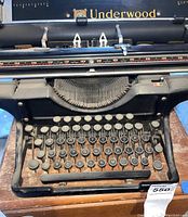 Front view of vintage Underwood typewriter showing keyboard and brand name.