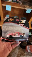 Front view of the Bill Elliott No. 39 Coors NASCAR die-cast car in original Winner's Circle packaging showing car and branding.