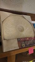Photo of boxed ceiling medallion showing decorative details and packaging