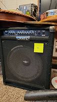 Front view of Crate bass amplifier showing speaker, grille, control panel with knobs and switches.