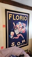 Frontal view of large framed Florio painting hung on wall, showing full artwork and frame details.