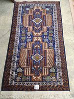 Full view of the rectangular carpet showing overall border and central field design